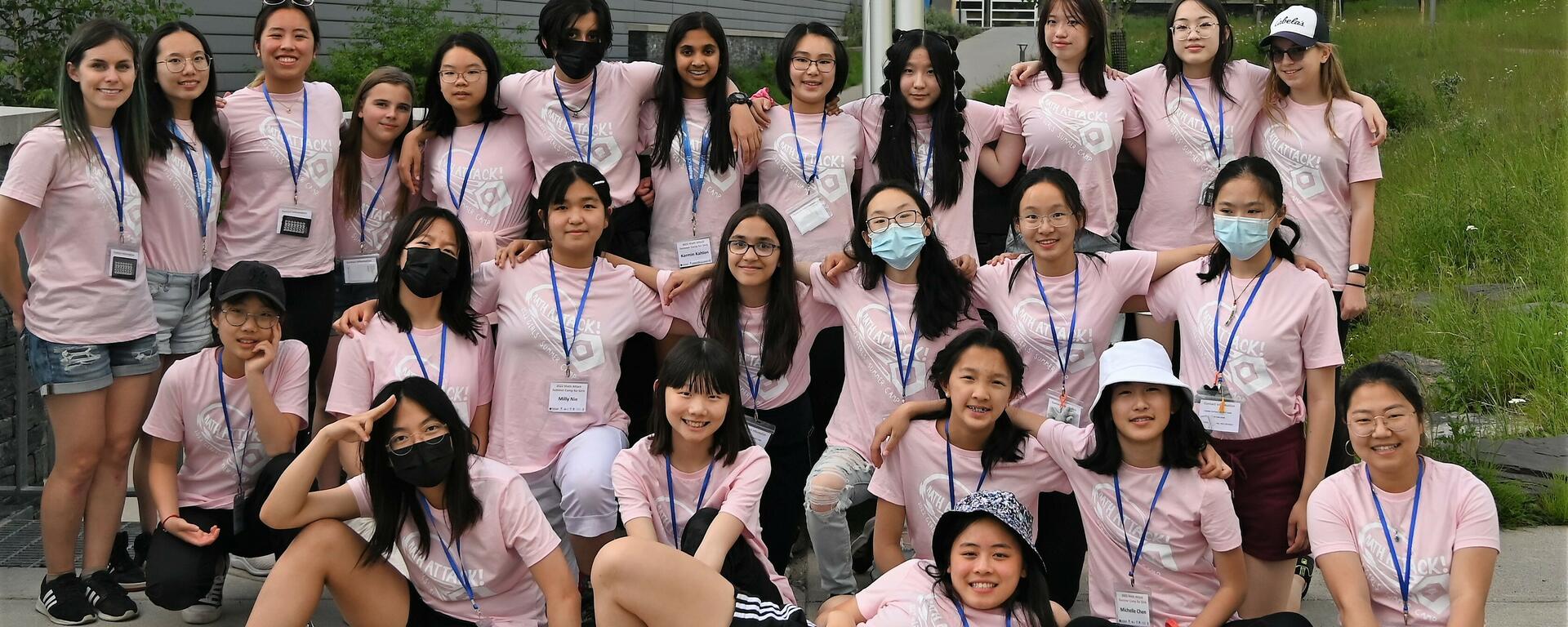 a group of girls at math camp, wearing pink t-shirts