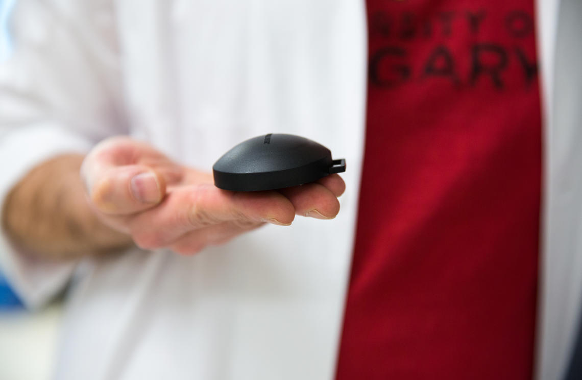 A radon test device is smaller than a hockey puck and requires no electricity. Photo by Riley Brandt, University of Calgary