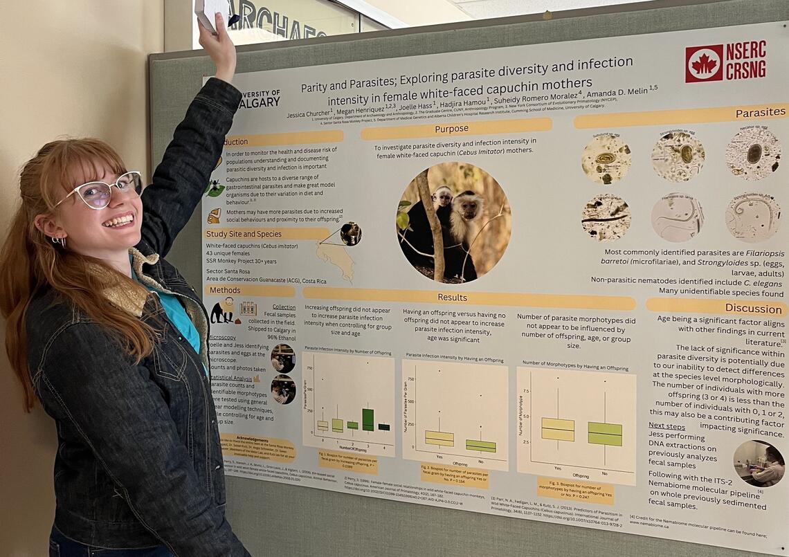 Jess Churcher stands in front of her NSERC research poster.