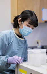 Researcher in Xiaoli Lilly Pang's lab at Alberta Precision Laboratories' public health lab..